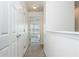 Bright hallway leads to a bedroom filled with natural light at 1304 Liberty Nw Pkwy # 1610, Atlanta, GA 30318