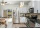 A bright kitchen with stainless steel appliances and backyard view at 1304 Liberty Nw Pkwy # 1610, Atlanta, GA 30318