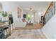 Spacious open-concept living room with hardwood floors, a neutral sofa, and abundant light at 1304 Liberty Nw Pkwy # 1610, Atlanta, GA 30318