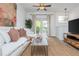 Bright living room featuring natural light, a neutral sofa, and a stylish console table at 1304 Liberty Nw Pkwy # 1610, Atlanta, GA 30318