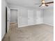 Expansive bedroom featuring plush carpeting and a ceiling fan at 2335 Plummer Sw Pl, Marietta, GA 30064