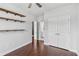 Bedroom with hardwood floors, two wall shelves and closet access at 2335 Plummer Sw Pl, Marietta, GA 30064