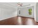 Primary bedroom featuring hardwood flooring and tray ceilings at 2335 Plummer Sw Pl, Marietta, GA 30064