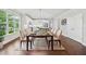 Well-lit dining area features hardwood floors and adjacent kitchen at 2335 Plummer Sw Pl, Marietta, GA 30064