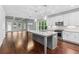 Open kitchen with center island, stainless appliances, and hardwood flooring at 2335 Plummer Sw Pl, Marietta, GA 30064