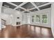 Spacious living room boasts coffered ceiling, fireplace, and large windows at 2335 Plummer Sw Pl, Marietta, GA 30064