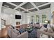Bright living room with a fireplace, coffered ceilings and lots of natural light at 2335 Plummer Sw Pl, Marietta, GA 30064