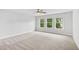 Spacious main bedroom with ample natural light and neutral carpeting at 2335 Plummer Sw Pl, Marietta, GA 30064