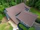 Bird's-eye view of the home, showcasing the roof, landscaping, and surrounding natural beauty at 2674 Skylane Dr, Marietta, GA 30062