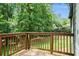 Wood deck overlooking lush backyard provides serene outdoor living and entertaining space at 2674 Skylane Dr, Marietta, GA 30062