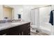 Bathroom featuring a granite vanity, shower with curtain, and modern fixtures at 2674 Skylane Dr, Marietta, GA 30062