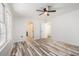 Sunlit bedroom with updated floors, two windows, ceiling fan and convenient access to ensuite bath at 2674 Skylane Dr, Marietta, GA 30062