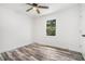 Bedroom featuring hardwood floors, neutral walls, a ceiling fan, and plenty of natural light at 2674 Skylane Dr, Marietta, GA 30062