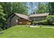 Beautifully landscaped yard surrounds this home with green grass and an inviting facade at 2674 Skylane Dr, Marietta, GA 30062