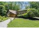 Home's exterior showcasing a beautiful lawn and stone walkway leading to the entrance at 2674 Skylane Dr, Marietta, GA 30062