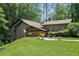 Inviting exterior elevation of the home features green grass and meticulous landscaping at 2674 Skylane Dr, Marietta, GA 30062
