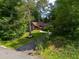 Landscaped exterior of home on a verdant lot, complemented by mature trees and charming curb appeal at 2674 Skylane Dr, Marietta, GA 30062
