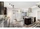 Open kitchen featuring dark wood cabinets, granite counters, stainless appliances, and modern track lighting at 2674 Skylane Dr, Marietta, GA 30062