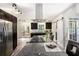 The spacious kitchen island features granite countertops, stainless steel appliances, and a modern design at 2674 Skylane Dr, Marietta, GA 30062