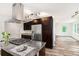 Modern kitchen with granite counters, stainless appliances, and gas cooktop island at 2674 Skylane Dr, Marietta, GA 30062