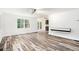 Open living area with modern floors, white walls, and access to a deck, perfect for entertaining at 2674 Skylane Dr, Marietta, GA 30062
