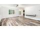 Open-concept living area with modern flooring and access to the outdoor deck at 2674 Skylane Dr, Marietta, GA 30062