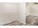 Walk-in closet with wood floor adjacent to the bedroom at 2674 Skylane Dr, Marietta, GA 30062