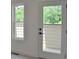 White balcony door with a window, showing the view from the house, next to a window at 289 White St # 3, Marietta, GA 30060