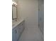 Bright bathroom featuring double vanity with marble countertops and modern fixtures plus glass enclosed shower at 289 White St # 3, Marietta, GA 30060