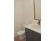 Powder room featuring elegant vanity with gold hardware and light countertop at 289 White St # 3, Marietta, GA 30060