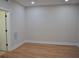 Empty bedroom with hardwood floors, base molding, and neutral paint at 289 White St # 3, Marietta, GA 30060
