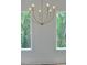 Stylish chandelier set against a backdrop of windows with a view of the trees outside at 289 White St # 3, Marietta, GA 30060