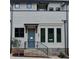 Close up on townhome exterior with blue door and brick stairway and base at 289 White St # 3, Marietta, GA 30060