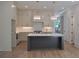 Modern kitchen with white cabinets, quartz countertop, and gray island at 289 White St # 3, Marietta, GA 30060