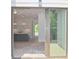 Open concept kitchen featuring a view of the backyard and stainless steel appliances at 289 White St # 3, Marietta, GA 30060