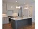 Elegant kitchen featuring a spacious island, stainless steel appliances, and modern pendant lighting at 289 White St # 3, Marietta, GA 30060