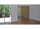 Open-concept living room featuring hardwood floors, large windows, and views of a deck at 289 White St # 3, Marietta, GA 30060
