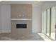 Bright living room featuring a tiled fireplace and sliding glass doors to a deck at 289 White St # 3, Marietta, GA 30060