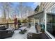 Back deck with outdoor seating, table, umbrella, and a view of the yard at 3819 Trotters Run, Douglasville, GA 30135