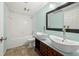 Bathroom with dual vessel sinks, large mirror, and a separate tub and shower at 3819 Trotters Run, Douglasville, GA 30135
