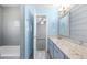 A full bathroom with gray walls, a tub, and a vanity with a white countertop and gray cabinetry at 3819 Trotters Run, Douglasville, GA 30135