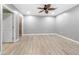 Bedroom featuring a ceiling fan, light vinyl floors, and neutral walls at 3819 Trotters Run, Douglasville, GA 30135