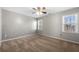 Spacious bedroom features gray walls, neutral carpet, and two windows at 3819 Trotters Run, Douglasville, GA 30135