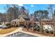 Community clubhouse featuring manicured landscaping and inviting outdoor seating areas at 3819 Trotters Run, Douglasville, GA 30135