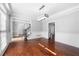 Elegant dining room with hardwood floors, crown molding, and a modern light fixture at 3819 Trotters Run, Douglasville, GA 30135