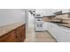 Bright kitchen featuring white cabinets, stainless steel appliances, and granite countertops at 3819 Trotters Run, Douglasville, GA 30135