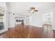 Open-concept living room with hardwood floors and a view into the modern kitchen at 3819 Trotters Run, Douglasville, GA 30135