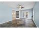 Cozy sunroom with slate floors, blue walls, ceiling fan, and double doors to the outside at 3819 Trotters Run, Douglasville, GA 30135