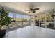 Bright sunroom with tile floors, large windows, and a view of the backyard at 3819 Trotters Run, Douglasville, GA 30135