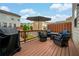Cozy back deck with outdoor seating and grill, perfect for relaxation and entertaining at 4202 Morrison Way # 9, Atlanta, GA 30341